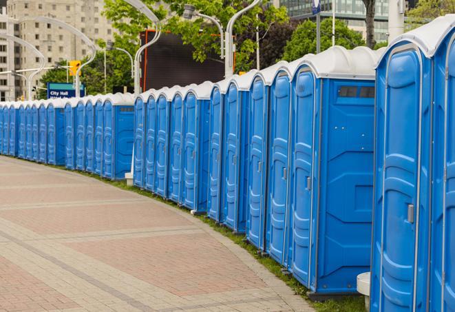 multiple portable restrooms in a neat and tidy row in Bagdad AZ